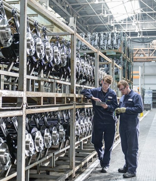 Workers inspecting axels